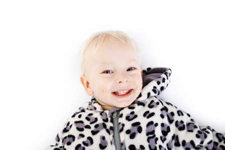 Portrait of cute little smiling boy wearing hoodie isolated on white backgroundの写真素材