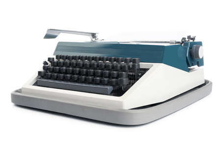 Typewriter with blank paper isolated on a white backgroundの写真素材