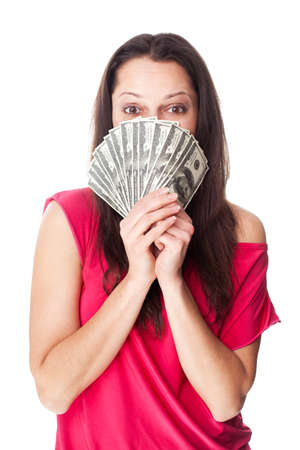 Portrait of pretty young smiling woman holding a dollar bills isolated on white backgroundの写真素材