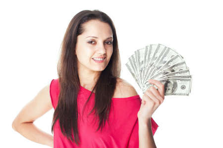 Portrait of pretty young smiling woman holding a dollar bills isolated on white backgroundの写真素材