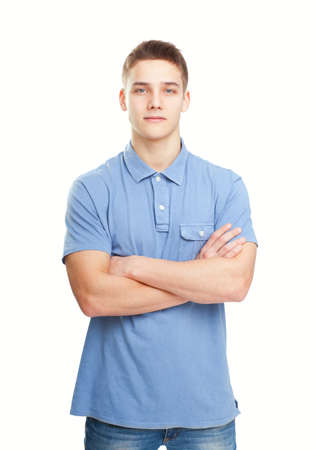Portrait of happy smiling man standing with hands folded against isolated on white backgroundの写真素材