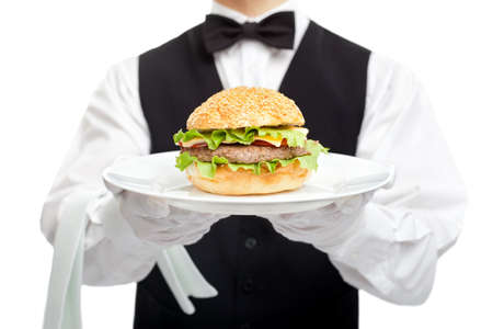 Waiter torso with hamburger on plate isolated on white backgroundの写真素材
