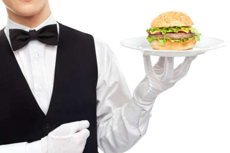 Waiter torso with hamburger on plate isolated on white backgroundの写真素材