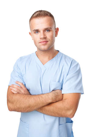 Portrait of happy smiling young male nurse in uniform isolated on white backgroundの写真素材
