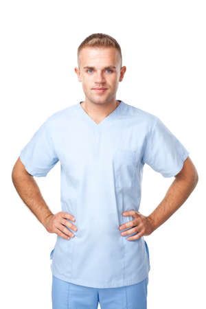 Portrait of happy smiling young male nurse in uniform isolated on white backgroundの写真素材