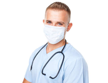 Portrait of young medical doctor in mask isolated on white backgroundの写真素材