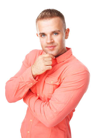 Portrait of happy smiling young man holding hand up to chin with arms folded isolated on white backgroundの写真素材