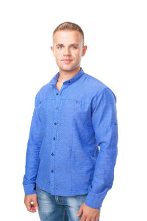 Portrait of smiling young man wearing a blue shirt isolated on white backgroundの写真素材
