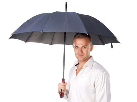 Portrait of young man under an umbrella isolated on white backgroundの写真素材