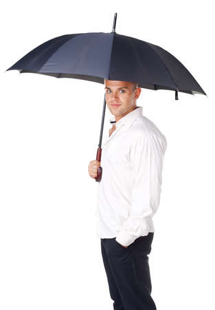 Portrait of young man under an umbrella isolated on white backgroundの写真素材