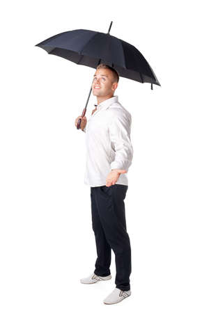 young man under an umbrella with his hand out isolated on white backgroundの写真素材