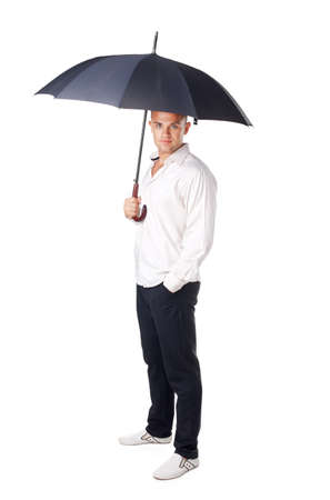 Portrait of young man under an umbrella isolated on white backgroundの写真素材