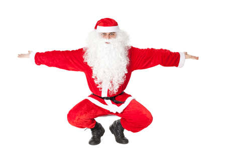 Dancing Santa Claus isolated on white backgroundの写真素材