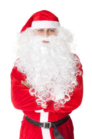 Portrait of Santa Claus standing with hands folded against isolated on white background の写真素材
