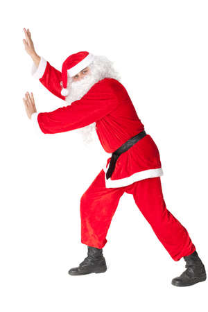 Santa Claus pushing something isolated on white background の写真素材