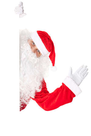 Santa Claus waving with blank sign isolated on white background の写真素材