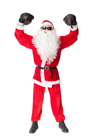Santa Claus wearing sunglasses with boxing glove smoking a cigar isolated on white background の写真素材