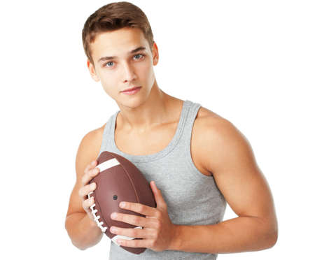 Portrait of young man holding rugby ball isolated on white backgroundの写真素材