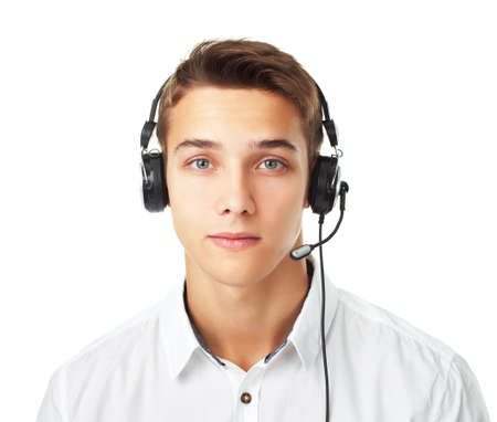 Closeup portrait of young man call center employee with a headset isolated on white backgroundの写真素材