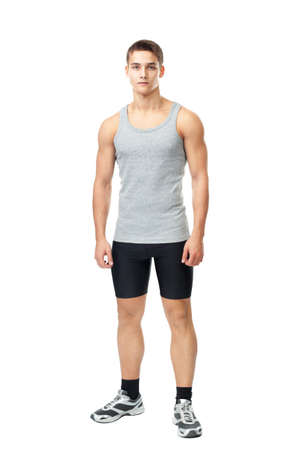 Full length portrait of young muscular athlete man isolated on white の写真素材