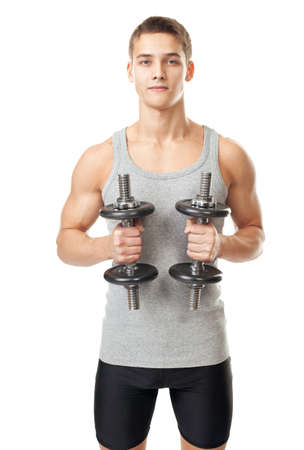 Portrait of young fit muscular man exercising with dumbbells isolated on white backgroundの写真素材