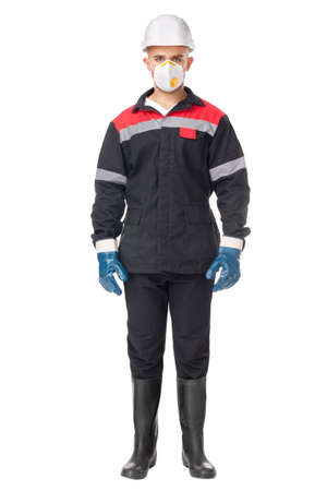 Full length portrait of young worker wearing safety protective gear isolated on white backgroundの写真素材