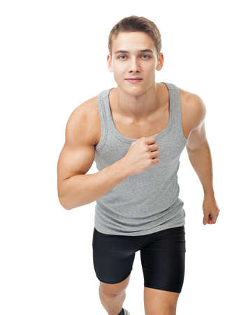 Portrait of young man athlete running isolated on white backgroundの写真素材