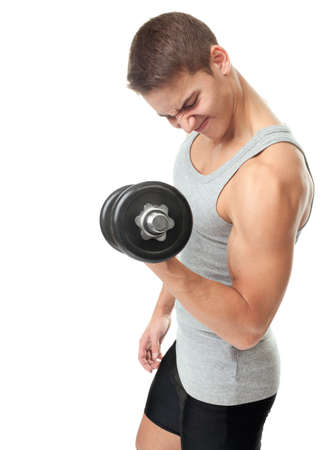 Portrait of young fit muscular man exercising with dumbbells for training his biceps isolated on white backgroundの写真素材