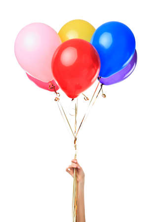 Hand holding colorful balloons isolated on white backgroundの写真素材