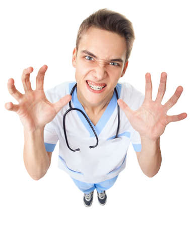 Wide angle top view of crazy angry young doctor isolated on white backgroundの写真素材