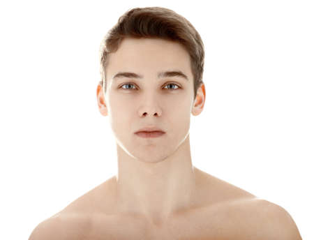 Closeup portrait of young man with health clean skin isolated on white backgroundの写真素材