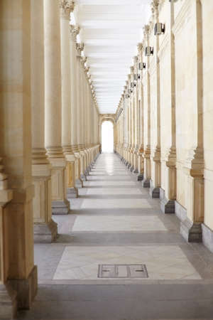 Long corridor with columns in an old buildingの写真素材