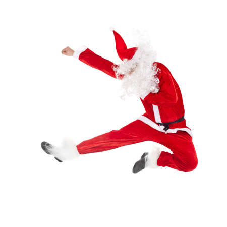 Happy Christmas Santa Claus jumping isolated on white backgroundの写真素材