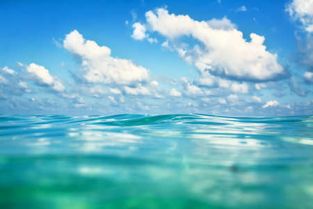 Sea and clouds. Focus on the wave