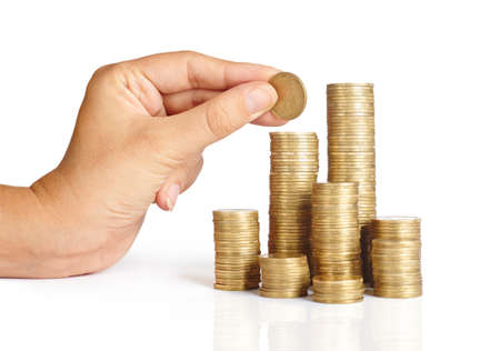 Hand put coins to stack of coins on white background ,Business idea, Savings,の写真素材