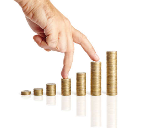 Fingers walking up on stacks of coins isolated on white background. Business Concept