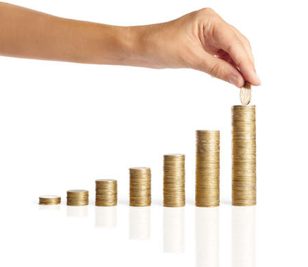 Hand put coins to stack of coins isolated on white background ,Business ideaの写真素材