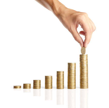 Hand put coins to stack of coins on white background ,Business ideaの写真素材