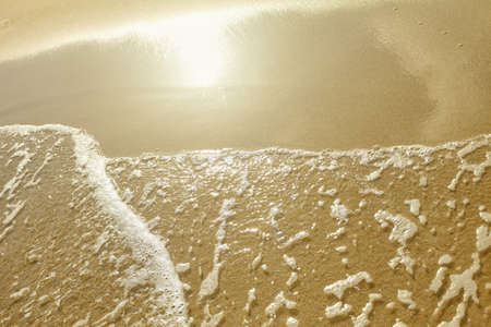 Sand beach and sea waveの写真素材