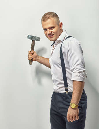 Angry man with hammerの写真素材