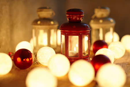 Christmas background with lanterns, baubles and garland. Holiday conceptの写真素材