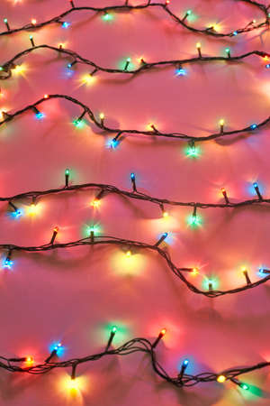 Background of colorful Christmas lights. Decorative garland
