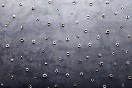 Abstract metal screw nuts backgroundの写真素材