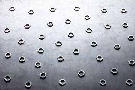 Abstract metal screw nuts backgroundの写真素材