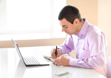 Business man working with documents and laptop in the officeの写真素材