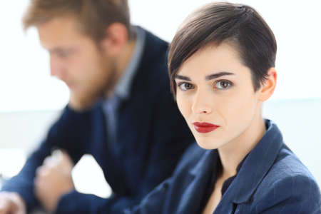 Portrait of young beautiful businesswoman in the officeの写真素材