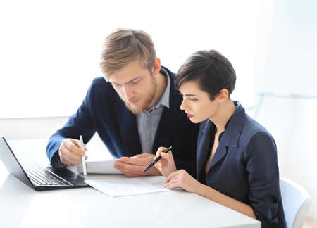 Business people reading contract in the office