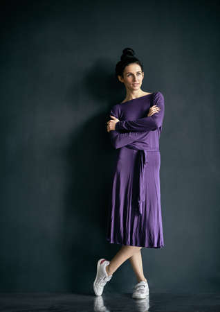 Latino dancer girl posing on dark backgroundの写真素材