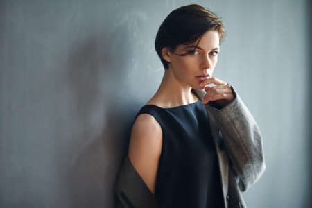 Portrait of sexy fashion woman on dark backgroundの写真素材