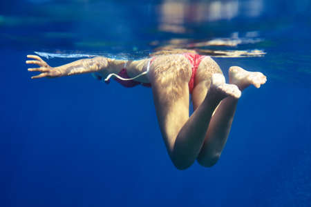 woman buttocks and legs underwater. Vacationの写真素材